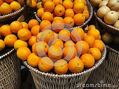 Oranges display in bamboo basket Stock Photo