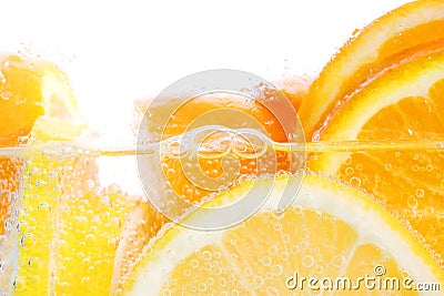 Oranges and lemons in water Stock Photo