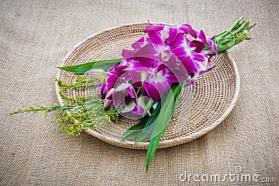 Orchid Bouquet in placemat on sackcloth Stock Photo