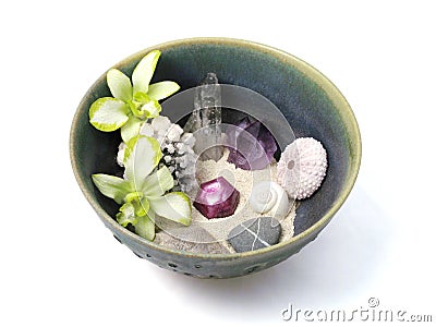 Orchids, Crystals, Shells, and Stones in Handmade Ceramic Bowl Stock Photo