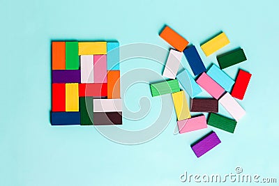 Order and chaos. Chaotic unorganized colored dominoes and ordered. Concept of business model, organization. L Stock Photo