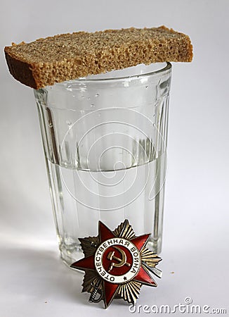 The order `Great Patriotic war` and glass with vodka and piece of bread Editorial Stock Photo