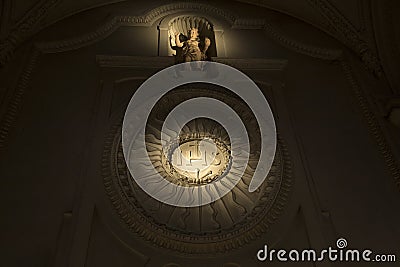 The Christogram IHS at the wall in Catholic church Stock Photo