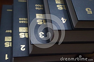 Golden numbers on a enciclopedia from one to five Stock Photo