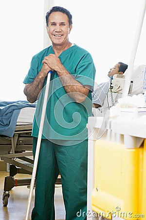 An Orderly Mopping The Floor In A Hospital Stock Photo