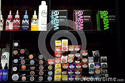 Orenburg, Russia - December 19, 2020: Black shelf with hair care products in a beauty salon. Modern beauty salon interior. Editorial Stock Photo