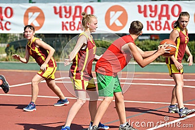 Orenburg, Russia - July 30, 2017 year: Girls and boys play Street Basketball Editorial Stock Photo