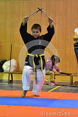 Orenburg, Russia - 30 October 2016: The boy performs exercises with metal Trident Editorial Stock Photo