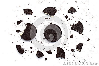 Oreo Biscuits with broken and crumbs isolated on white background. It is a sandwich chocolate cookies with a sweet cream. Editorial Stock Photo