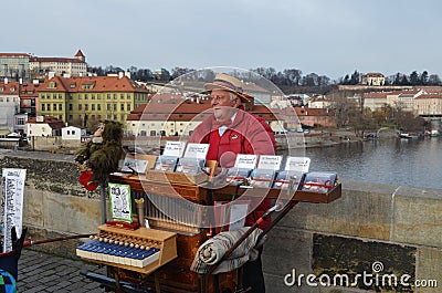 The organ grinder on Charles Bridge in Prague Editorial Stock Photo