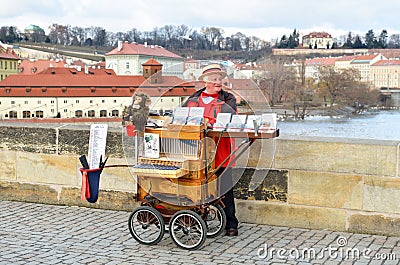 Organ grinder in city of Prague Editorial Stock Photo