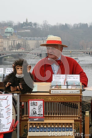 The organ grinder and a monkey. Editorial Stock Photo