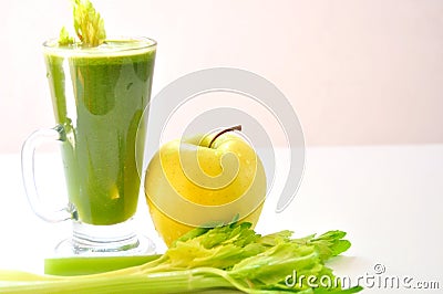 Organic apple and celery juice on a white background Stock Photo