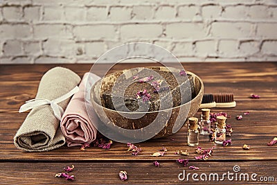 Organic aromatic handmade soap in a coconut bowl and personal care items made of natural materials . Stock Photo