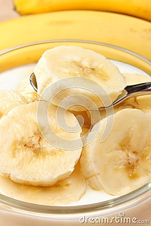 organic banana slices in natural yoghurt Stock Photo