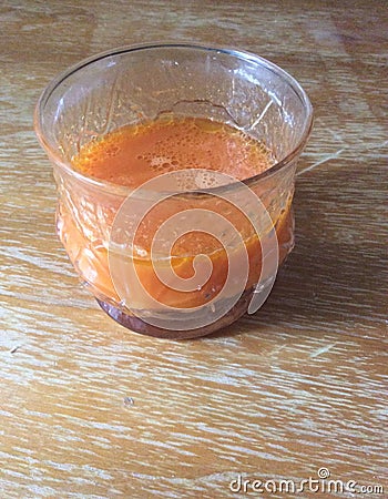 Organic Carrot Juice with Olive Oil Drops Stock Photo