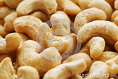 Organic cashew without shell on the background. Organic golden walnut closeup. Stock Photo