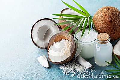 Organic coconut products for spa, cosmetic or food ingredients decorated palm leaves. Natural oil, water and shavings. Stock Photo