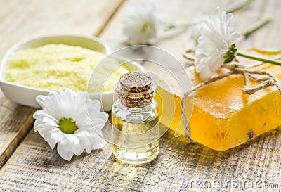 Organic cosmetics with camomile extract on wooden table background Stock Photo