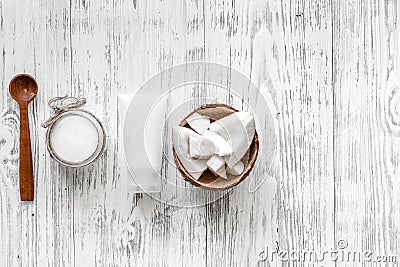 Organic cosmetics with coconut. Coconut cream and oil on wooden background top view copyspace Stock Photo