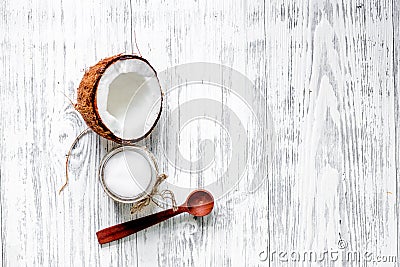 Organic cosmetics with coconut. Coconut oil on wooden background top view copyspace Stock Photo