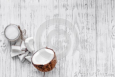 Organic cosmetics with coconut. Coconut oil on wooden background top view copyspace Stock Photo