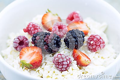 Organic cottage cheese with blackberry, strawberry and raspberry Stock Photo