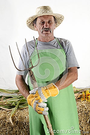 Organic farmer with a pitchfork Stock Photo