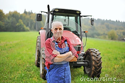 Farmer and his Red Tractor Stock Photo