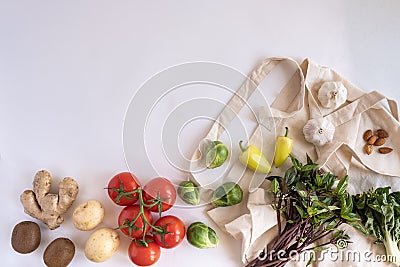 Organic fresh vegetable with the eco cotton bag on white background flat lay Stock Photo