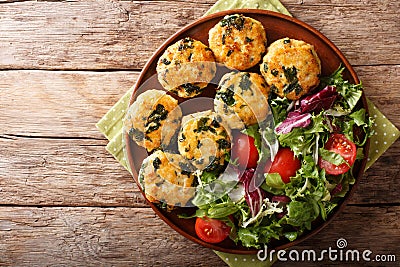 Organic fried meatballs with spinach and vegetable salad close-up. horizontal top view Stock Photo