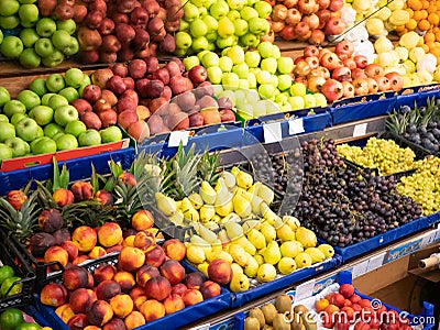 Organic fruit counters at green food store market Editorial Stock Photo