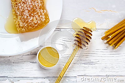 Organic honeycomb, honey lip balm and natural wax candles Stock Photo