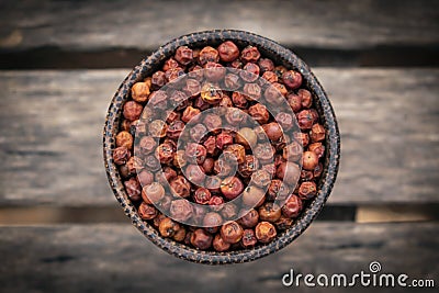 Organic kampot dried red pepper corns in cambodia Stock Photo