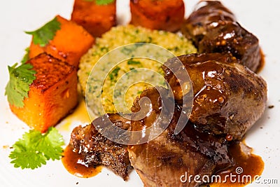 Organic meat of lamb cooked with slices pumpkin Stock Photo