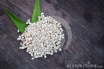 Organic millet grains on old wooden table background, top view Stock Photo