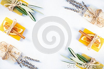 Three pieces of soap and herbs. Stock Photo