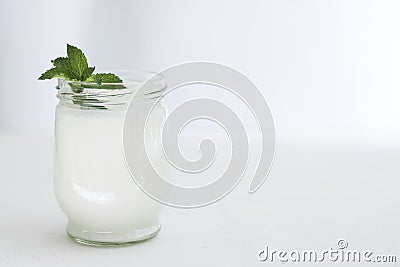 Organic probiotic milk kefir drink or yogurt in glass containers,on the white grey background. Gut health. Probiotic cold Stock Photo