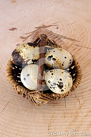 organic quail eggs in a basked Stock Photo
