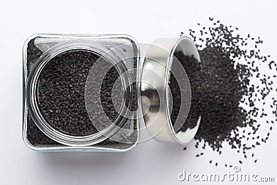 Organic Sesame seedsSesamum indicum or Black Til with shell in a glass jar with Lid, Stock Photo