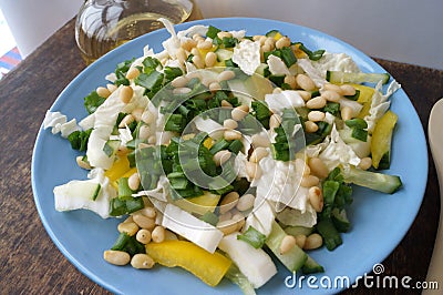 Organic, vegetarian salad from fresh vegetables with pine nuts Stock Photo