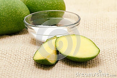 Organic whole and sliced Indian Mango (Mangifera indica), Stock Photo