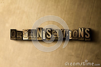 ORGANISATIONS - close-up of grungy vintage typeset word on metal backdrop Cartoon Illustration