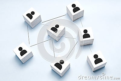 Organization structure, team building, recruitment, business management and human resources concepts. Person icons on wooden cubes Stock Photo