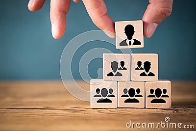 Organization and team structure symbolized with cubes Stock Photo