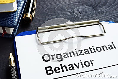 Organizational Behavior report on a desk. Stock Photo