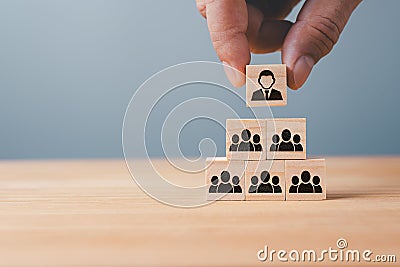 Organizational and team structure symbolized by stacked cubes Stock Photo