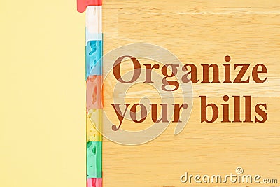 Organize your bills message with file organizer tabs Stock Photo