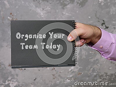 Organize Your Team Today inscription on the piece of paper Stock Photo