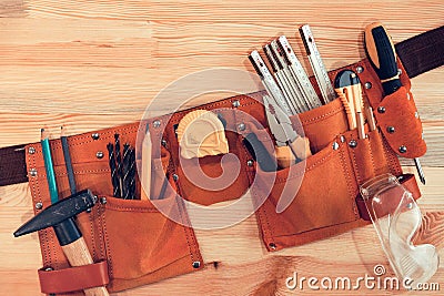 Organized handyman tool belt Stock Photo